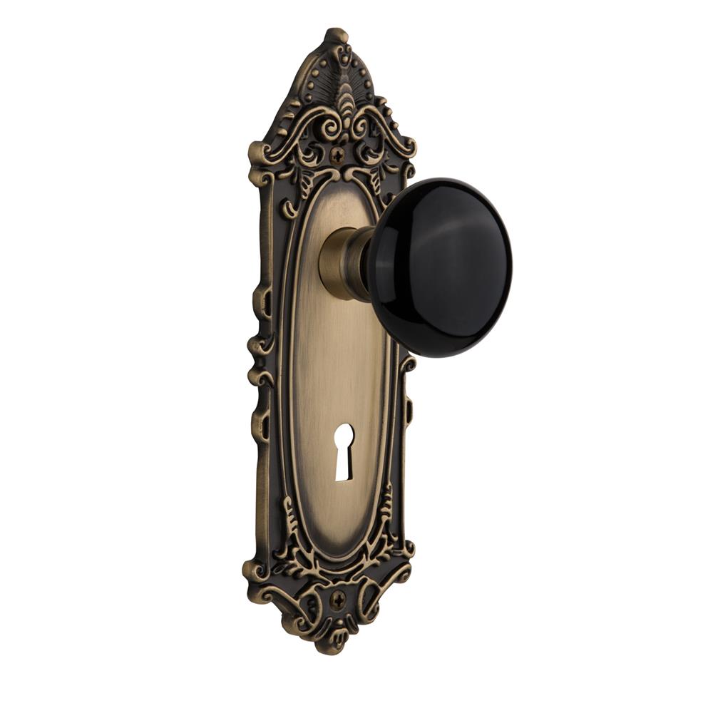 Nostalgic Warehouse VICBLK Double Dummy Victorian Plate with Black Porcelain Knob with Keyhole in Antique Brass